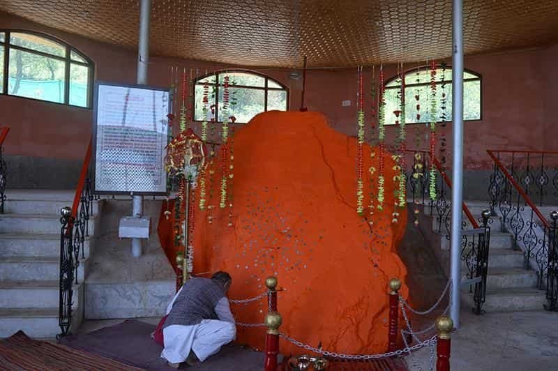 Sacred shrine with devotee in prayer